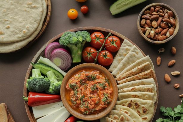 Overhead shot of a wooden platter with veggies, flatbreads, and dips for a graphic prompt